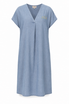 Light blue lightweight denim dress with a loose, flowy silhouette and v-neck, mid-calf to ankle length