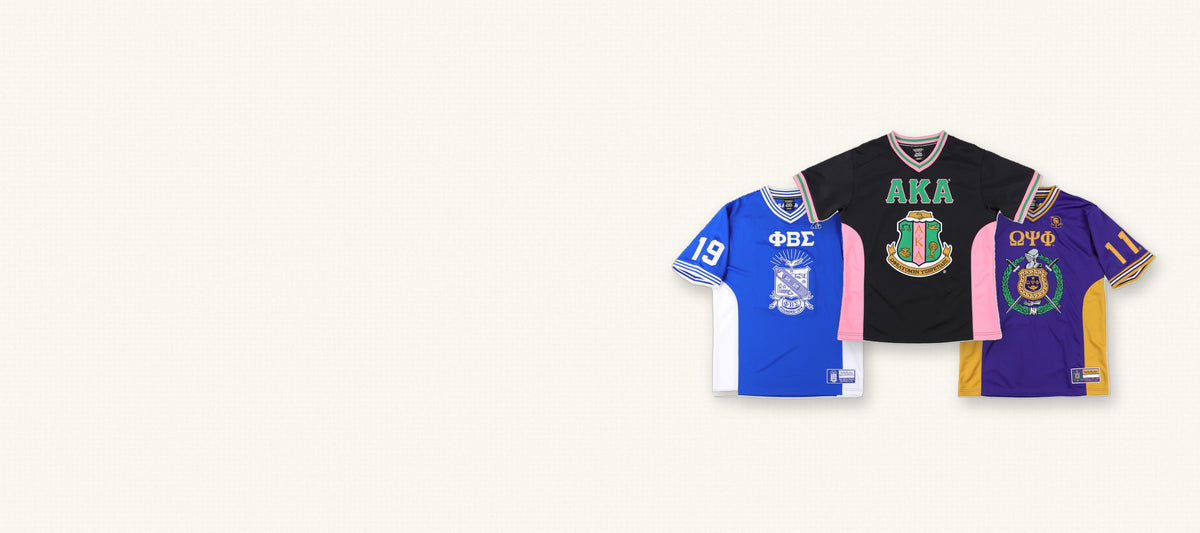 Three embroidered football jerseys: Phi Beta Sigma, Alpha Kappa Alpha and Omega Psi Phi